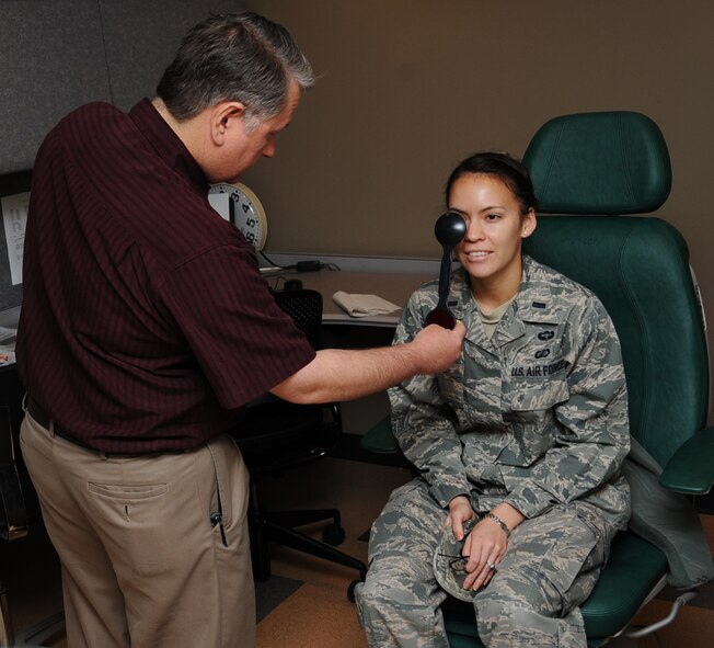 Michael Hoskins, 2nd Aerospace Medical Squadron paraoptometric technician, gives a cover test to 1st Lt. Tiffanie Katz, 2nd Comptroller Squadron financial services flight commander, during a routine eye exam on Barksdale Air Force Base, La., April 4, 2013. The test is used to detect for a muscle imbalance which can cause a patient to be prescribed glasses. (U.S. Air Force photo/Senior Airman Sean Martin)