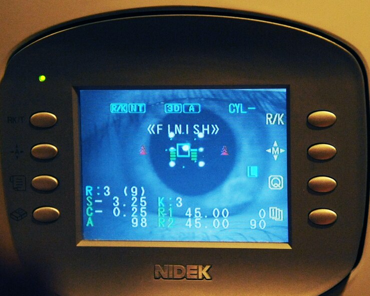 A picture of a patient's eye is taken using an auto-refractor/karotometer during a routine eye exam on Barksdale Air Force Base, La., April 4, 2013. An auto-refractor gives a patient's baseline prescription and a karotometer measures the curvature of the cornea. (U.S. Air Force photo/Senior Airman Sean Martin)