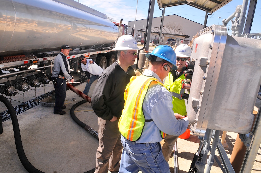 A gas tanker delivers 7,500 of E-85 fuel to Robins. Base personnel and contractors with Weston Solutions checks lines for leaks and to ensure the system was working properly. The pump is now open. ( U. S. Air Force photo by Sue Sapp/Released) 

