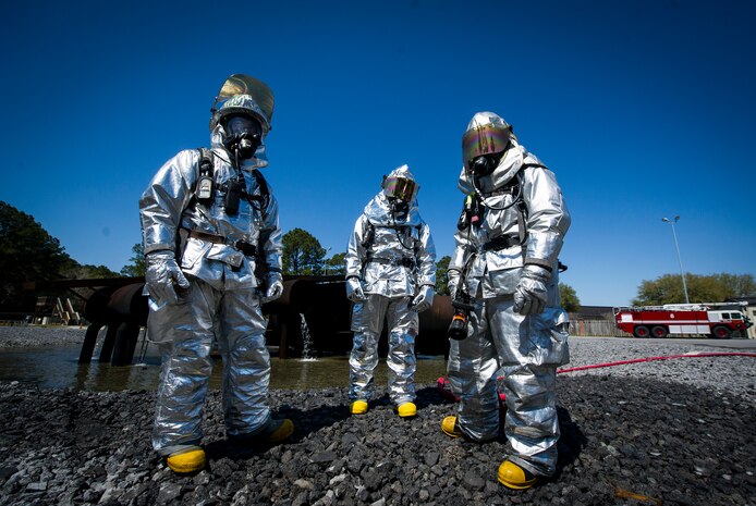 Members from the 628th Civil Engineer Squadron gather in preparation for an aircraft, live-fire training exercise March 29, 2013, at Joint Base Charleston – Air Base, S.C. The base performs quarterly aircraft, live-fire training for firefighters and crew chiefs to maintain their qualifications. (U.S. Air Force photo/ Senior Airman George Goslin)