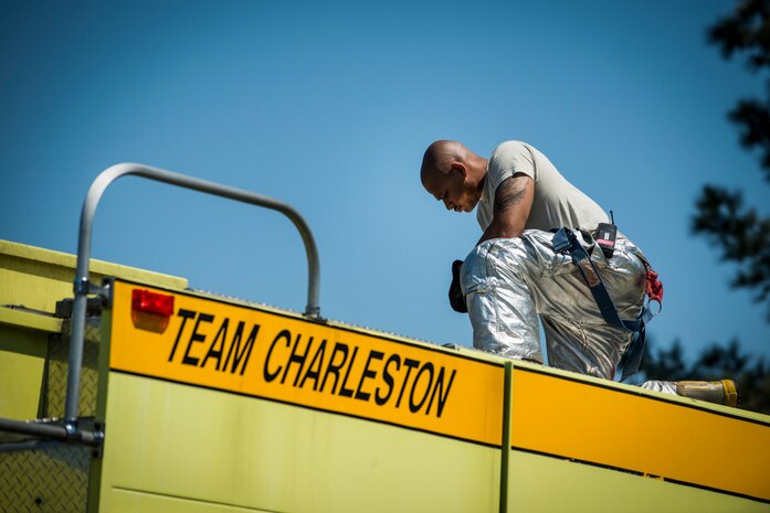 Staff Sgt. Leatrice Robinson, 628th Civil Engineer Squadron crew chief, opens tanks to relieve pressure while filling the Striker 3000 fire truck’s 1,500 gallon tank during an aircraft, live-fire training exercise March 29, 2013, at Joint Base Charleston – Air Base, S.C. The base performs quarterly aircraft, live-fire training for firefighters and crew chiefs to maintain their qualifications. (U.S. Air Force photo/ Senior Airman George Goslin)