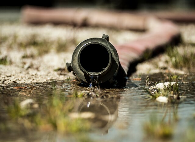 Fire hoses are attached to a fire hydrant and then connected to a Striker 3000 fire truck, which holds 1,500 gallons of water, during an aircraft, live-fire training exercise March 29, 2013, at Joint Base Charleston – Air Base, S.C. The base performs quarterly aircraft, live-fire training for firefighters and crew chiefs to maintain their qualifications. (U.S. Air Force photo/ Senior Airman Dennis Sloan)