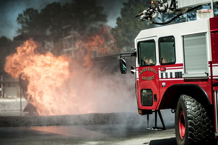 A Striker 3000 fire truck sprays water on a fire during an aircraft, live-fire training exercise March 29, 2013, at Joint Base Charleston – Air Base, S.C. The base performs quarterly aircraft, live-fire training for firefighters and crew chiefs to maintain their qualifications. (U.S. Air Force photo/ Senior Airman Dennis Sloan)