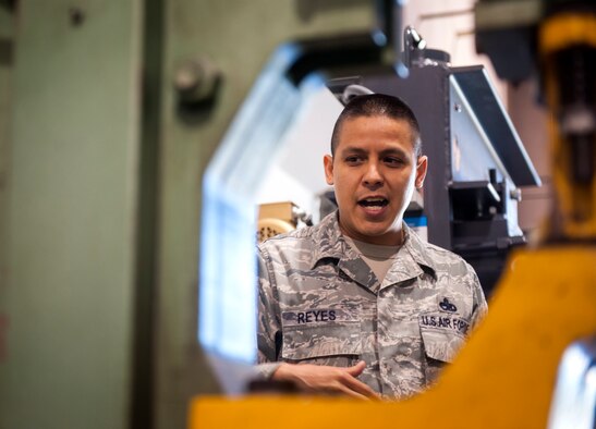 U.S. Air Force Master Sgt. Felipe Reyes, 23d Equipment Maintenance Squadron NCO in charge of aircraft metals technology, explains how different pieces of equipment works during a health-risk assessment at Moody Air Force Base, Ga., March 25, 2013. Bioenvironmental Airmen conduct these assessments to ensure jobs don’t have negative impacts on Airmen or the environment. (U.S. Air Force photo by Senior Airman Jarrod Grammel/Released)
