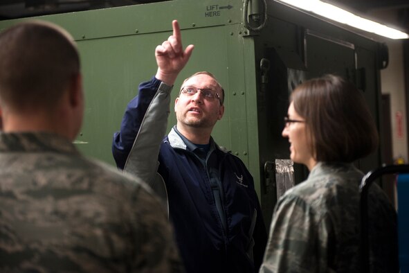 Ryan Fictum, a senior occupational health and safety specialist, points to a ventilation system as bioenvironmental Airmen look on during a health-risk assessment at Moody Air Force Base, Ga., March 25, 2013. During health-risk assessments, bioenvironmental Airmen look for possible hazards to help ensure short-term and long-term safety of Airmen. (U.S. Air Force photo by Senior Airman Jarrod Grammel/Released)
