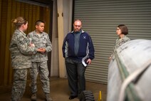 U.S. Air Force Master Sgt. Felipe Reyes, 23d Equipment Maintenance Squadron NCO in charge of aircraft metals technology, talks to Staff Sgt. Krisiti Gillespie (far left), 23d Aerospace Medicine Squadron industrial hygiene team leader, Ryan Fictum (second from right), a senior occupational health and safety specialist, and Capt. Stephanie Harley, 23d AMDS Bioenvironmental Engineering Flight commander, about possible work-place hazards at Moody Air Force Base, Ga., March 25, 2013. Bioenvironmental Airmen conduct health-risk assessments to ensure units are within Occupational Safety and Health Administration regulations. (U.S. Air Force photo by Senior Airman Jarrod Grammel/Released) 
