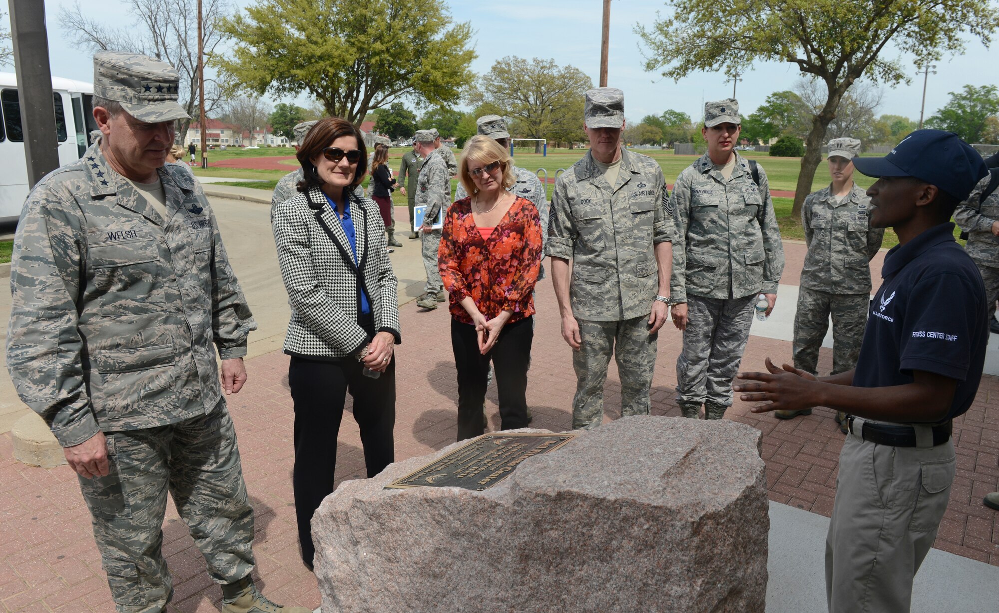 Senior Airman Arthur Williams, 2nd Force Support Squadron, tells Air Force Chief of Staff Gen. Mark A. Welsh III and with Chief Master Sgt. of the Air Force James A. Cody about the newly dedicated Senior Airman Bryan Bell Fitness Center on Barksdale Air Force Base, La., April 2, 2013. (U.S. Air Force photo/Senior Airman Micaiah Anthony)