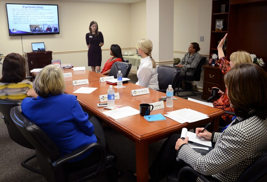 Georgette Price, Military Student Transition Consultant, speaks with Betty Welsh, wife of Air Force Chief of Staff Gen. Mark A. Welsh III, Athena Cody, wife of Chief Master Sgt. of the Air Force James A. Cody, and other Barksdale leadership spouses on how she is helping military children transition into local area schools during a briefing at the Airman and Family Readiness Center on Barksdale Air Force Base, La., April 2, 2013. (U.S. Air Force photo/Staff Sgt. Amber Ashcraft)