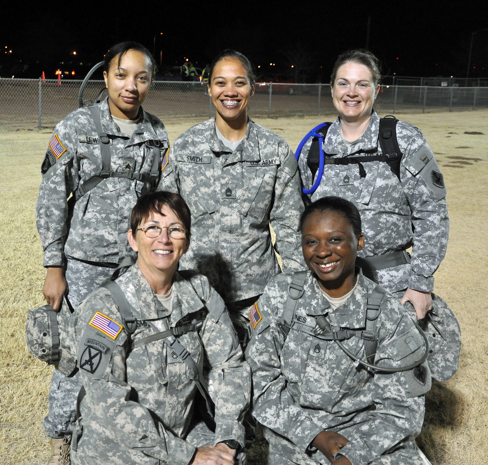 WHITE SANDS MISSILE RANGE, New Mexico--Bataan Memorial Death March military female light category team members pose for a team photo, March 17. This team is comprised of 344th Military Intelligence Battalion Army females stationed at Goodfellow Air Force Base. The annual memorial march commemorates the heroic service members who defended the Philippine Islands during World War II. (courtesy photo)