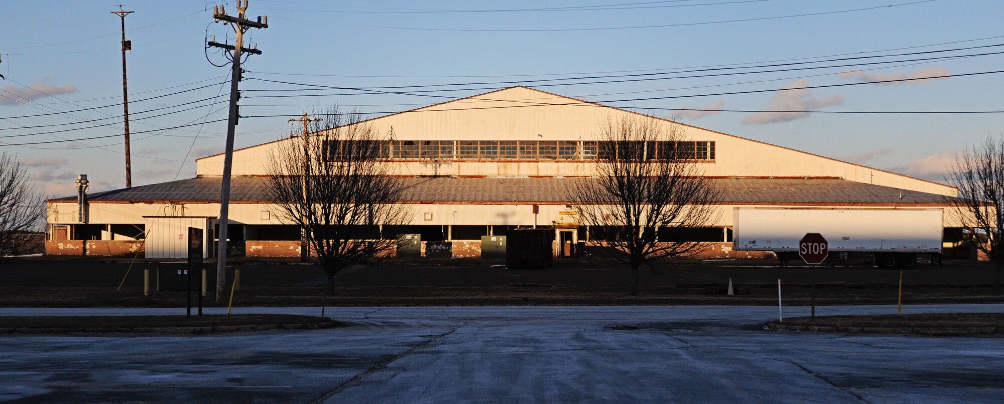 The next major demolition project was the removal of building 128, which was a former aircraft hangar that the Army National Guard was previously using as storage. The removal of the building started in February and the buildings final wall was torn down on March 29. (National Guard photo by Tech. Sgt. Kerri Cole/Released)