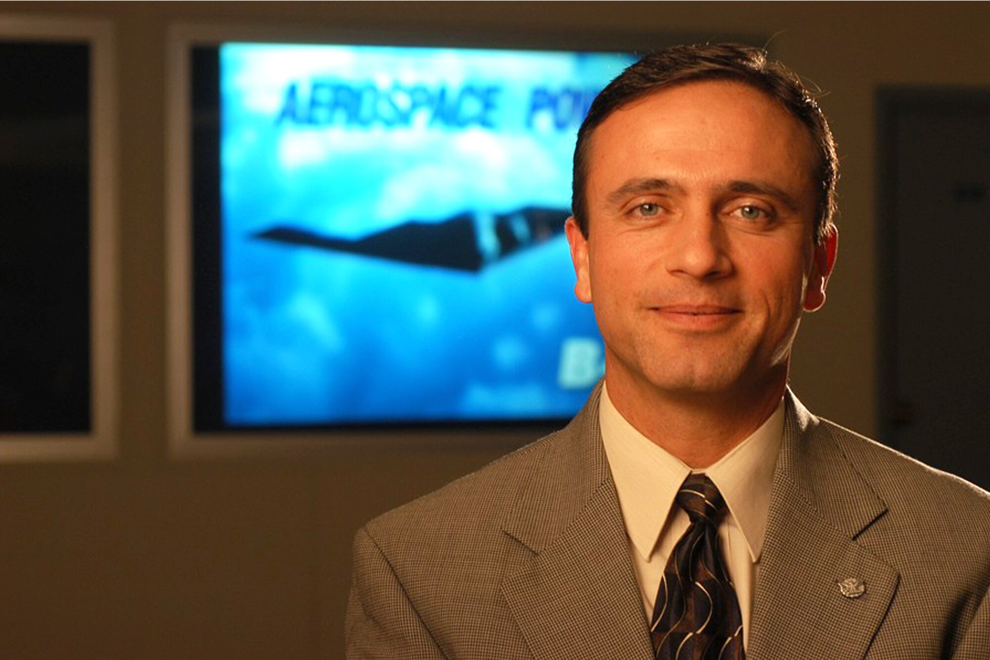 The imagery behind Kevin Stamey, Engineering and Technical Management director, symbolizes how he never wants to forget where he came from, and why he aspired to be an SES. He’d always told himself if he were ever in a staff job that he’d find ways to best serve the programs. “If we’re not benefitting the programs, what’s the point?” he wondered aloud. “If we’re only benefitting our own personal interest as a functional, we’re missing the purpose.” (Courtesy Photo)