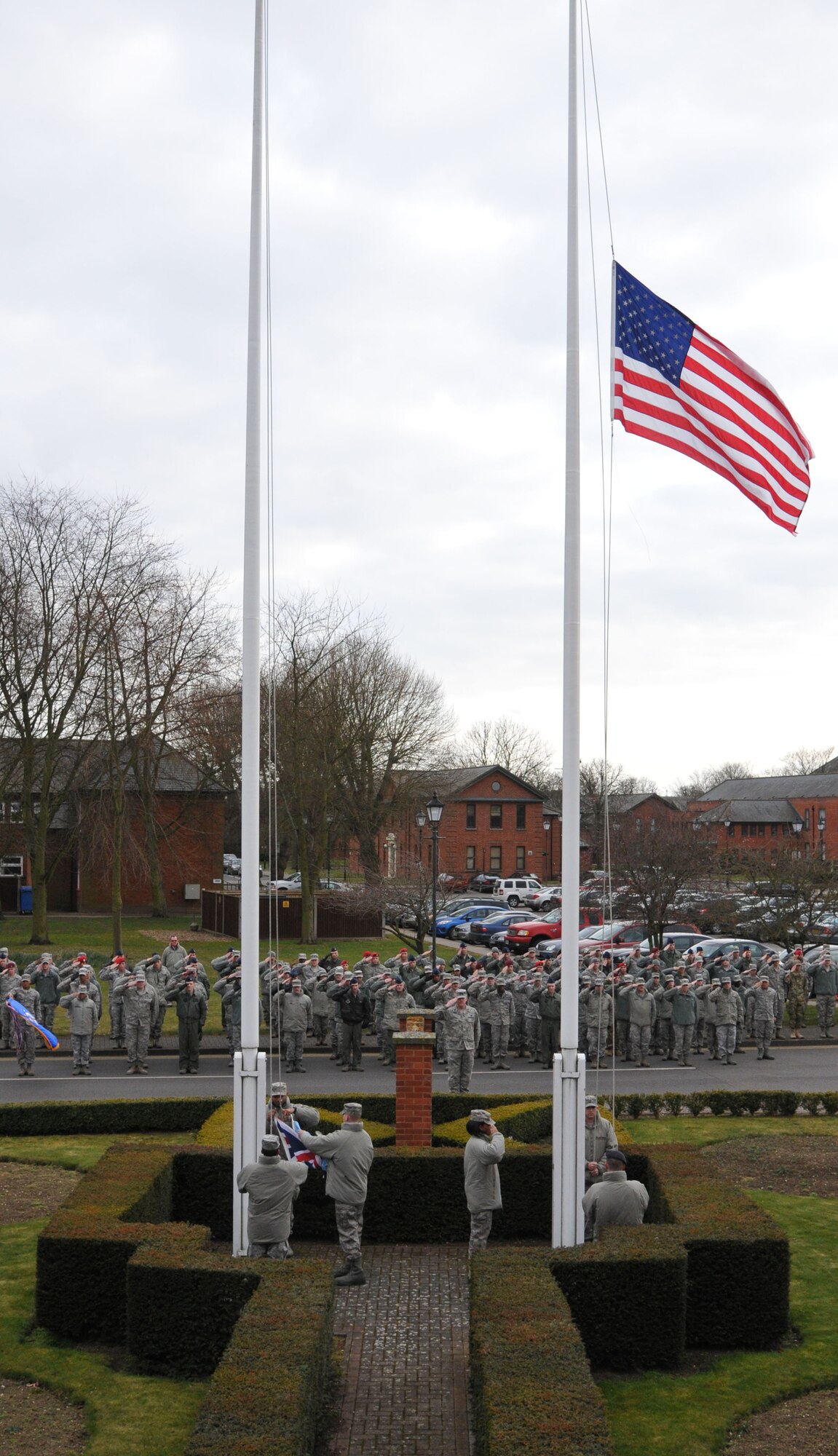 Airmen from the 352nd Special Operations Group perform a retreat ceremony March 29, 2013, on RAF Mildenhall, England. The retreat ceremony was one of the events of 352nd SOG Heritage Week March 25 to 29. (U.S. Air Force photo by Airman 1st Class Kelsey Waters/Released)
