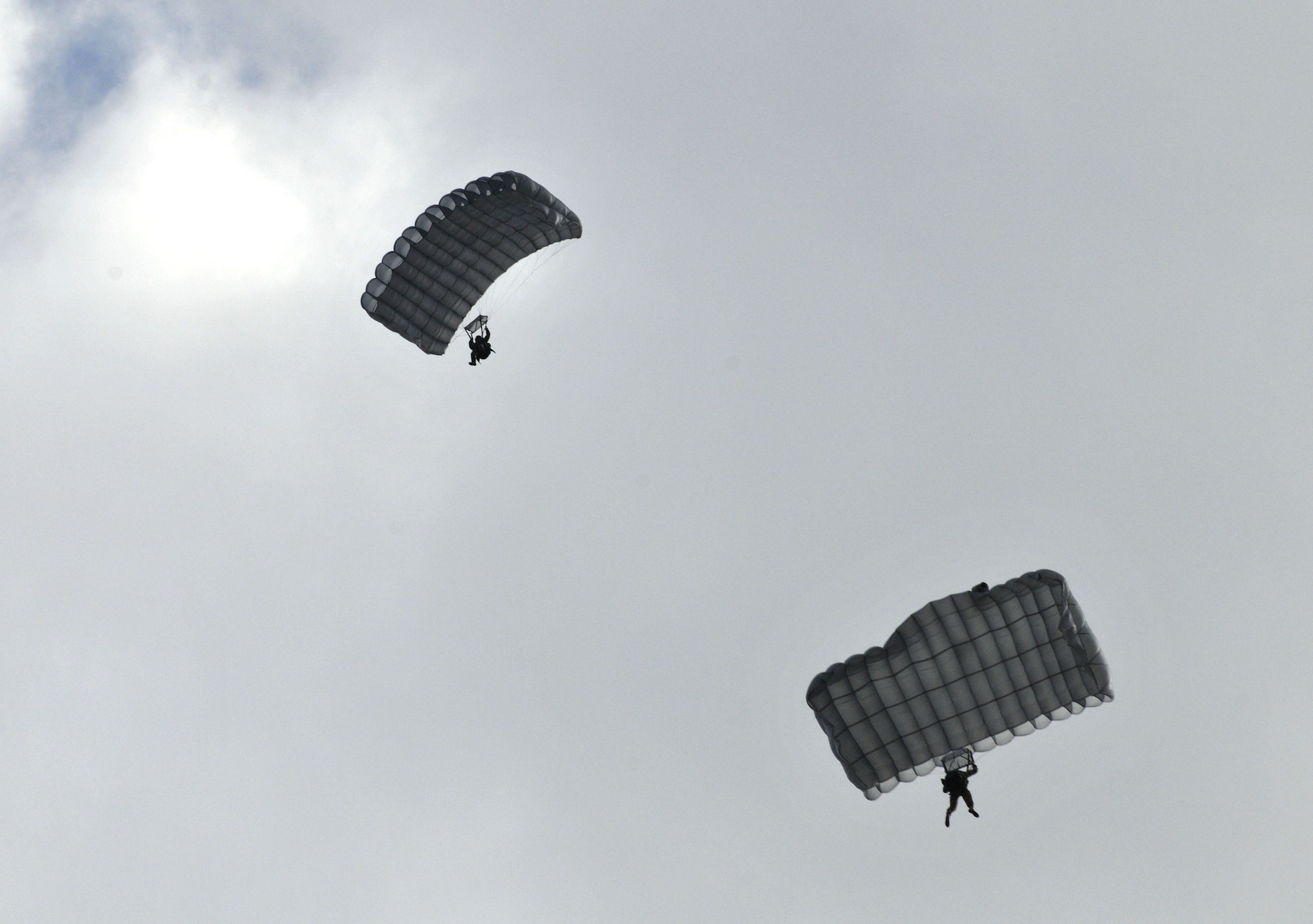 Airmen from the 321st Special Tactics Squadron participate in a freefall demonstration March 28, 2013, near hangar 539 at RAF Mildenhall, England.  The demonstration was part of the 352nd Special Operations Group Heritage week. (U.S. Air Force photo by Airman 1st Class Kelsey Waters/Released)