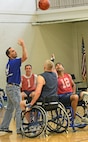 Claude Owens and Scott Palomino, players on the Air Force wheelchair basketball team,  compete against each other during tip off at the Rambler Fitness Center March 21, at Joint Base San Antonio-Randolph (U.S. Air Force photo by Benjamin Faske) (released)
