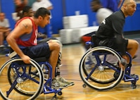 Scott Palomino, a player on the Air Force wheelchair basketball team, chases after a rebound during practice at the Rambler Fitness Center March 21, at Joint Base San Antonio-Randolph (U.S. Air Force photo by Benjamin Faske) (released)
