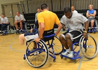 Matt Sanders, a player on the Air Force wheelchair basketball team, manuevers around a block during practice at the Rambler Fitness Center March 21, at Joint Base San Antonio-Randolph (U.S. Air Force photo by Benjamin Faske) (released)