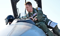 1st Lt. Spencer Bell, Texas Air National Guard F-16 pilot, inspects his aircraft before takeoff March 13, at Joint Base San Antonio-Lackland. (U.S. Air Force photo by Benjamin Faske) (released)