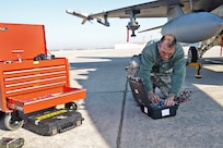 Tech Sgt. Garcia, Texas Air National Guard F-16 flight crew chief, conducts routine maientenace on an awaiting aircraft March 13, at Joint Base San Antonio-Lackland. (U.S. Air Force photo by Benjamin Faske) (released)