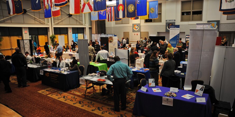 Job seekers meander throughout the annual job fair hosted by the Airman and Family Readiness Center April 3, 2013, McConnell Air Force Base, Kan. The job fair is held for military, dependants and retirees in search of career opportunities. (U.S. Air Force photo/Airman 1st Class Jose L. Leon)