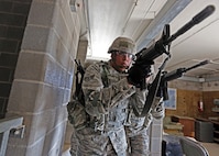 U.S. Air Force Airman from the 343d Training Squadron are conducting expeditionary ground combat training at the Joint Base San Antonio-Camp Bullis Combined Arms Collective Training Facility (CACTF) March 15, 2013. The Camp Bullis CACTF in San Antonio is a 25+ acre site with 16 structures agumented with a sports field, underground traininer , landing/pick-up zones, and city clutter. This allows for realistic training along with accurate and timely feedback for force-on-force and other operations. (U.S. Air Force photo by Joshua Rodriguez/released)