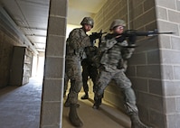 U.S. Air Force Airman from the 343d Training Squadron are conducting expeditionary ground combat training at the Joint Base San Antonio-Camp Bullis Combined Arms Collective Training Facility (CACTF) March 15, 2013. The Camp Bullis CACTF in San Antonio is a 25+ acre site with 16 structures agumented with a sports field, underground traininer , landing/pick-up zones, and city clutter. This allows for realistic training along with accurate and timely feedback for force-on-force and other operations. (U.S. Air Force photo by Joshua Rodriguez/released)