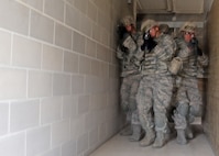 U.S. Air Force Airman from the 343d Training Squadron are conducting expeditionary ground combat training at the Joint Base San Antonio-Camp Bullis Combined Arms Collective Training Facility (CACTF) March 15, 2013. The Camp Bullis CACTF in San Antonio is a 25+ acre site with 16 structures agumented with a sports field, underground traininer , landing/pick-up zones, and city clutter. This allows for realistic training along with accurate and timely feedback for force-on-force and other operations. (U.S. Air Force photo by Joshua Rodriguez/released)