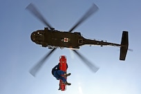 Members of the Texas Task Force 1 Urban Search and Rescue Response System TX-TF1 partners with the Texas Military Forces (TxMF) of the 149th Texas Army National Guard units to form a synergistic and robust aviation response on a UH-60 Blackhawk helicopter. TxMF provides the aviation assets and TX-TF1 provides the rescuers through the Helicopter Search and Rescue Technician program. (U.S. Air Force photo by Joshua Rodriguez/released)