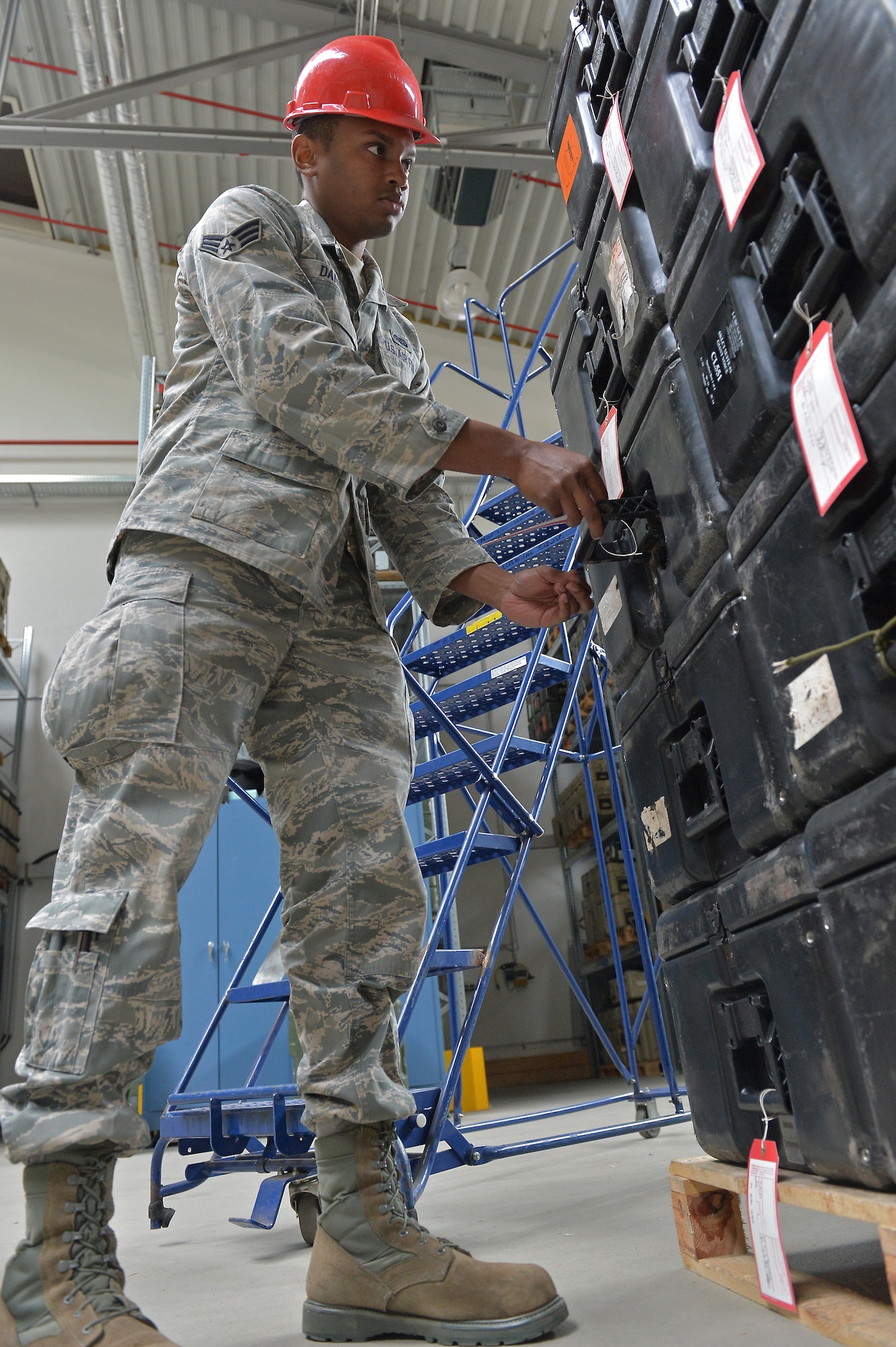 Senior Airman Howard Daniels, 1st Combat Communications Squadron radio frequency transmissions journeyman, tags faulty equipment on Ramstein Air Base, Germany, March 25, 2013. Daniels was recently awarded the Thunderbolt award for his superior achievements and work performance. (U.S. Air Force photo/Airman 1st Class Holly Cook) 