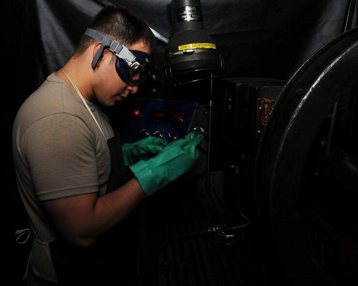 Senior Airman Josh Martinez, 2nd Maintenance Squadron non-destructive inspection, checks for cracks on a part from a B-52H Stratofortress on Barksdale Air Force Base, La., April 3, 2013. NDI Airmen look for cracks on parts using specialized equipment on the surface and subsurface level. (U.S. Air Force photo/Senior Airman Sean Martin)