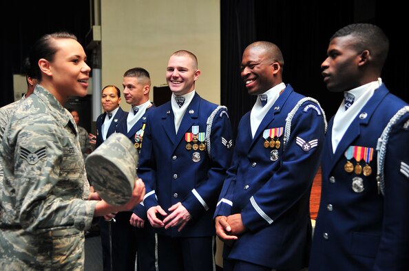 U.S. Air Force Senior Airman Amber Coley, 4th Medical Operations Squadron physical therapy technician, speaks to members of the U.S. Air Force Honor Guard Drill Team after a recruitment brief and demonstration on Seymour Johnson Air Force Base, N.C., Mar. 28, 2013. The drill team performs at public and military venues to recruit, retain and inspire Airmen. (U.S. Air Force photo by Airman 1st Class Aubrey White/Released)