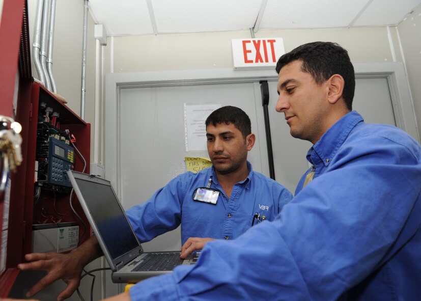 Mehmet Sami Sevinc and Ugur Uyar, both Vinnell-Brown and Root fire alarm technicians assigned to the 39th Civil Engineer Squadron, reset the fire suppression system in a dorm of Patriot Village, April 4, 2013, at Incirlik Air Base, Turkey.  The employees of VBR provide all maintenance and upkeep to facilities at Incirlik, including the lodging area for NATO service members temporarily stationed at Incirlik in support of the Patriot Mission to deter hostile actions near the Turkish-Syrian border. (U.S. Air Force photo by Staff Sgt. Marissa Tucker/Released)
