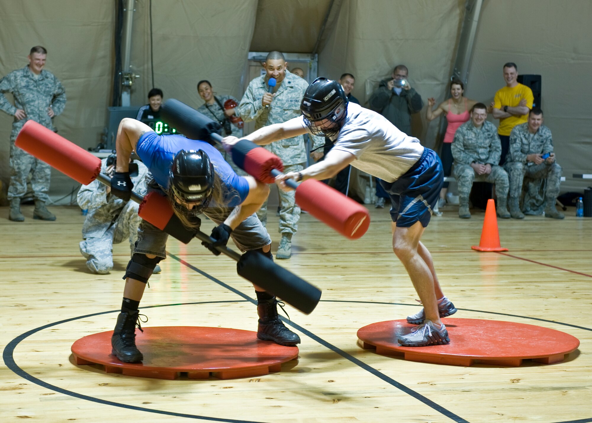 Capt. Richard McNell, 376th Air Expeditionary Wing sexual assault response coordinator, jousts against Wolf, American Gladiator, April 2, 2013, at Transit Center at Manas, Kyrgyzstan. Service members were able to compete against American Gladiators in similar games played on the TV show. McNell is deployed from Los Angeles Air Force Base, Calif., and is a native of Antioch, Calif.  (U.S. Air Force photo/Staff Sgt. Stephanie Rubi)