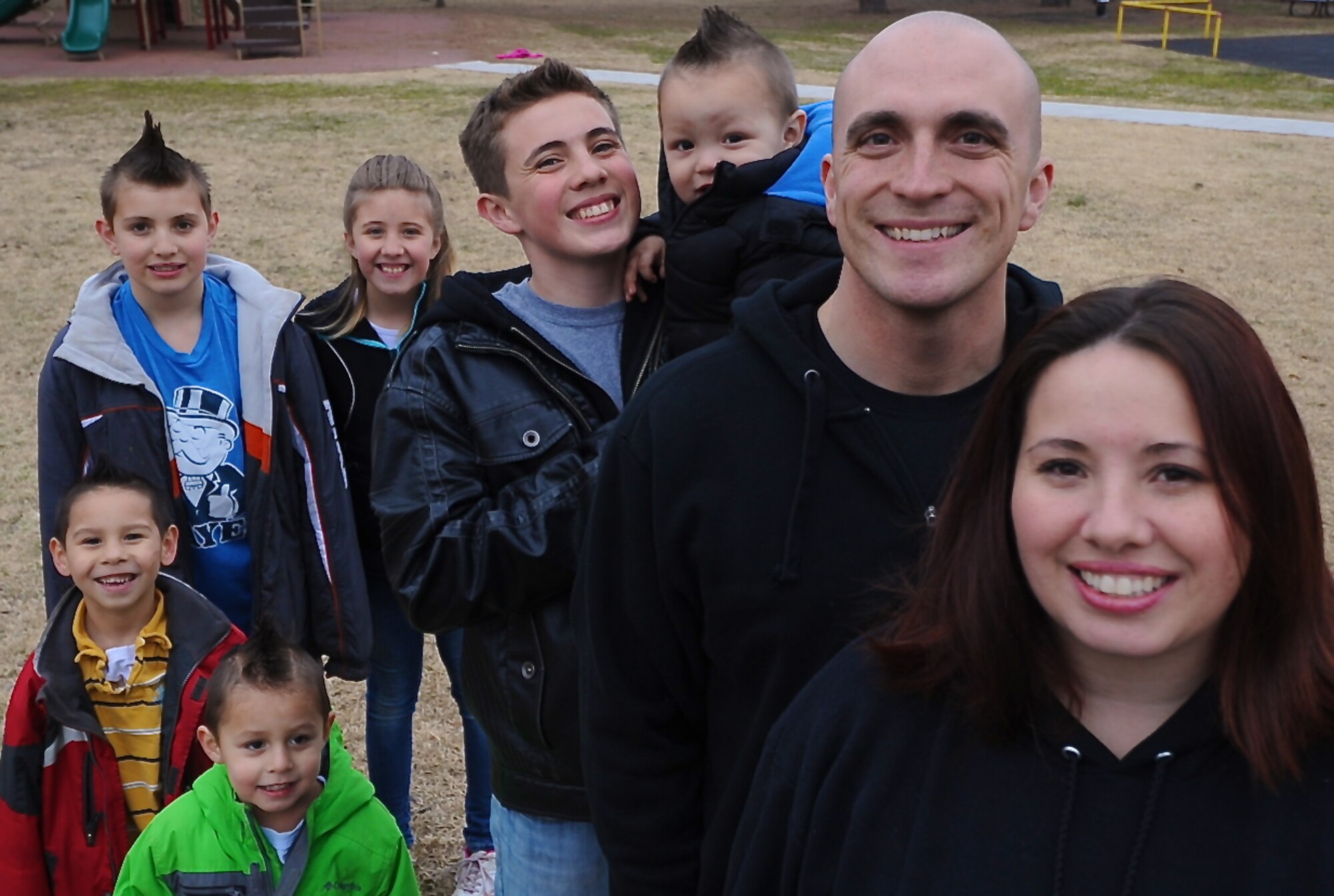 Muriel Cedillo, far right, alongside spouse of U.S. Air Force Tech. Sgt. Jacob Cedillo, 35th Aircraft Maintenance Squadron, stand with their six children for a family photo at Misawa Air Base, Japan, April 3, 2013. Muriel was named Pacific Air Forces Spouse of the Year on March 28, 2013. (U.S. Air Force photo by Senior Airman Derek VanHorn)