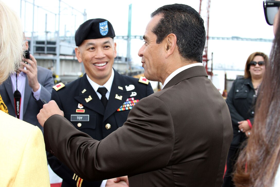 Mark Toy, the commander of the Los Angeles District, greets Los Angeles Mayor Antonio Villaraigosa, prior to the ribbon cutting ceremony aboard the USS Iowa April 3. The ceremony marked the completion of the 10-year, $370 million Port of Los Angeles channel deepening project managed by Los Angeles District.