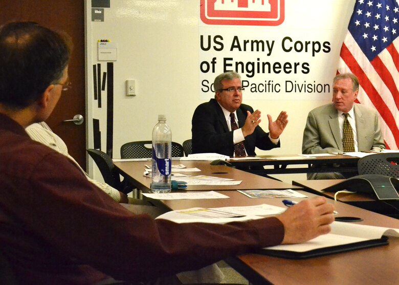 Mr. Joseph Calcara (left), Director of Programs South Pacific Division, speaks about the importance of contracting and the impact of budgetary challenges during the Bay Area Acquisition Roundtable here April 3, 2013 at South Pacific Division headquarters, San Francisco, Calif. The roundtable, started in 2010 by Jim Bartha (right), Regional Chief of Contracts, provided a forum to discuss federal contracting and acquisitions in Northern California.