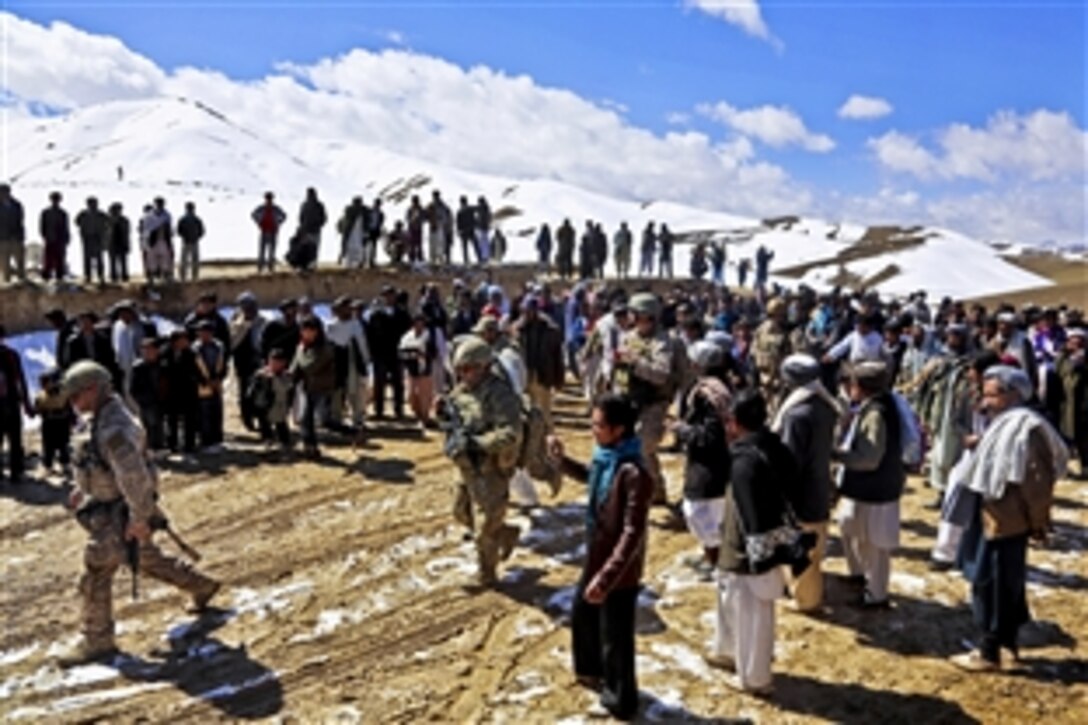 Coalition forces provide security and attend a meeting in a village in the Khas Uruzgan district of Afghanistan's Uruzgan province, March 16, 2013. The gathering drew more than 2,000 residents of the Siya Boghal village, including tribal leaders, religious leaders, youth and women. 