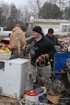 Sgt. Benjamin Anderson of the Arkansas Army National Guard's 2nd of the 142nd Fires Brigade helps local emergency crews sift through the aftermath of a tornado in Atkins, Ark., Feb. 6. Anderson, a full-time fireman in Fort Smith, Ark., and members of the 2nd of the 142nd were called to state active duty shortly after the devastating twister tore through the small community Feb.5.