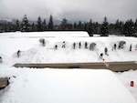 Idaho Army National Guard Soldiers from the 145th Brigade Support Battalion shoveled snow off Timberlake High School Feb. 2 in Spirit Lake, Idaho. Sixty-three Guardmembers deployed to remove snow from the roofs of nine schools in the northern part of the state after four feet of snow crippled school systems in three counties.