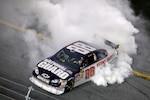 Dale Earnhardt Jr. celebrates his victory in the National Guard AMP Energy No. 88 Chevrolet following the Budweiser Shootout at the Daytona International Speedway Saturday night, Feb. 9.