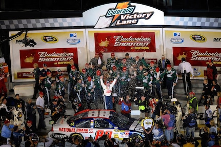 Dale Earnhardt Jr. celebrates his victory in the National Guard AMP Energy No. 88 Chevrolet following the Budweiser Shootout at the Daytona International Speedway Saturday night, Feb. 9.