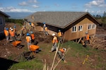 Hawaii National Guard Soldiers and Airmen clear flood debris near Kula on Maui in Hawaii in January during a mission to help residents affected by floods.