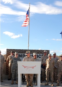 Lt. Col. James Starnes, commander of the 474th Civil Engineering Squadron, speaks at a ceremony Feb. 2 celebrating his unit's hard work building the Expeditionary Legal Complex. The complex includes a state-of-the-art courtroom designed to facilitate military commissions. Joint Task Force Guantanamo conducts safe and humane care and custody of detained enemy combatants. The JTF conducts interrogation operations to collect strategic intelligence in support of the Global War on Terrorism and supports law enforcement and war crimes investigations.