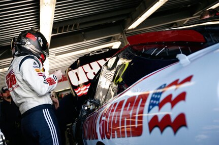 Dale Earnhardt Jr. works with Hendrick Motorsports team members in a garage at the Daytona International Speedway Feb. 16 for NASCAR's Nationwide Series Camping World 300. Earnhardt drove the National Guard sponsored No. 5 car that day to finish third after starting 19th. The following day, Earnhardt drove the Amp/National Guard co-sponsored No. 88 car in NASCAR's Sprint Cup Series 50th running of the Daytona 500. He led that race three times for 12 laps and finished ninth.