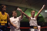 New York Guard Sgt. Cherrie Retamozzo triumphs over Navy Petty Officer 2nd Class Sonia Deputee during the 2008 Armed Forces Boxing Championships at Camp Lejeune, N.C.