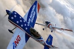 Maj. John Klatt, of the Air National Guard's aerobatic team in his Staudacher S-300D flies in concert with an Extra-300L flown by Michael Mancuso as they put two Air National Guard-sponsored aircraft through their paces in preparation for Air Force Week New England Aug. 25-26 at Otis Air Base, Cape Code, Mass. Klatt and his support team travel to air shows across the nation promoting the Air National Guard.