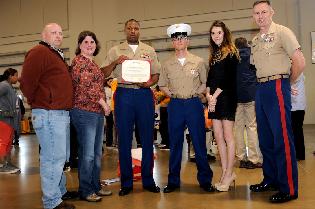 Lance Corporal Daniel Horvath, honor graduate of platoon 2026, along with the rest of his family stands with Col. William Bowers, commanding officer of 6th Marine Corps District and his recruiter, Sgt. Darryl Greenwood, after graduation aboard Parris Island, S.C., April 5, 2013. Horvath, who is a native of Memphis, Tenn. and was recruited from Recruiting Sub Station Germantown, Tenn., Recruiting Station Nashville, Tenn., will be able to enjoy some well deserved leave with his family after graduation. (U.S. Marine Corps photo by Cpl. Gabrielle Bustos)