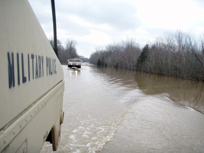 Members of the Missouri National Guard's 70th Troop Command ford a crossing near Piedmont, Mo., on March 19, 2008, while providing support to civilian authorities in the wake of Midwest storms that caused flooding in multiple states. President Bush declared a major disaster for the state.