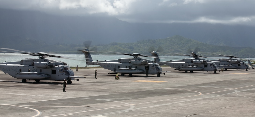 MARINE CORPS BASE HAWAII - Marines and sailors with Marine Heavy Helicopter Squadron 463 and Marine Light Attack Helicopter Squadron 367 challenged each other to a competition when they launched seven CH-53E Super Stallions, five AH1 Cobras and one UH1 Huey helicopter at Hangars 102 and 103, March 29. (U.S. Marine Corps photo by Lance Cpl. Jacob D. Barber)

