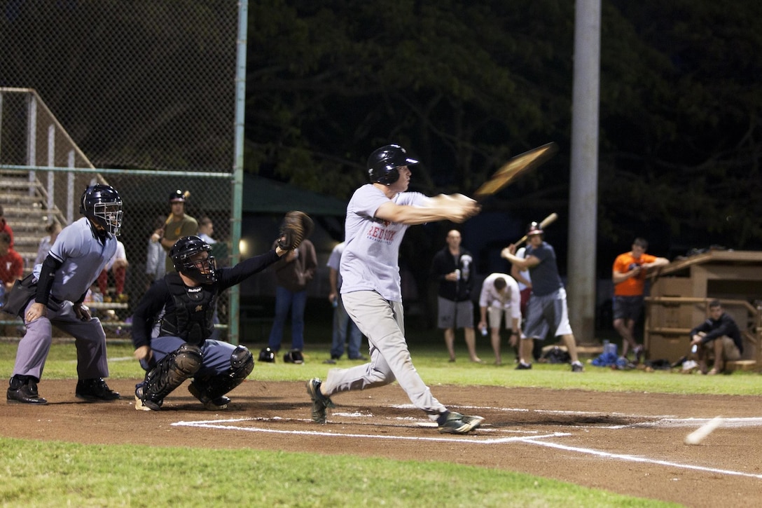 MARINE CORPS BASE HAWAII - Thomas Bush, pitcher for 3rd Radio Battalion, swings at a pitch during an intramural baseball league game against Weapons/Ordnance at Riseley Field, April 1.(U.S Marine Corps photo by Lance Cpl. Nathan Knapke)