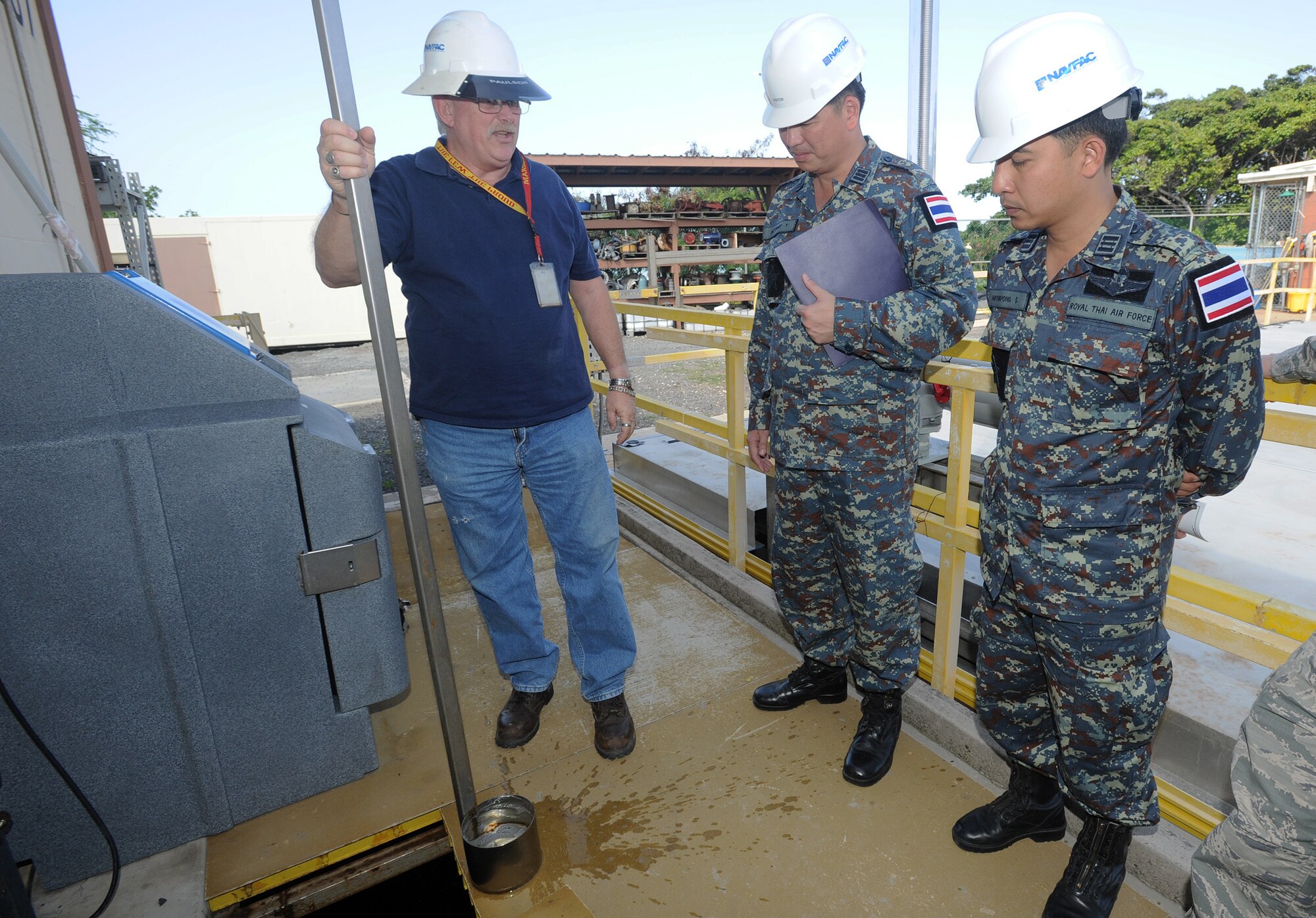 JOINT BASE PEARL HARBOR-HICKAM, Hawaii -- Mr. Paul Carter, Navy Facility Command Hawaii Wastewater Treatment Plant utility chief, displays a sample of treated water to members of the Royal Thai Air Force and Royal New Zealand Army as they participated in a Subject Matter Expert exchange as part of Pacific Unity/Defender April 3, 2013. Members of the Republic of Singapore Air Force, Japan Air Self-Defense Forces, Royal Thai Air Force, Royal New Zealand Army and Royal Cambodian Air Force participated in the exchange, part of U.S. Pacific Command’s Theater Security Cooperation Program, co-hosted by senior civil engineering and security forces personnel from Pacific Air Forces. (U.S. Air Force photo/Tech. Sgt. LuCelia Ball)